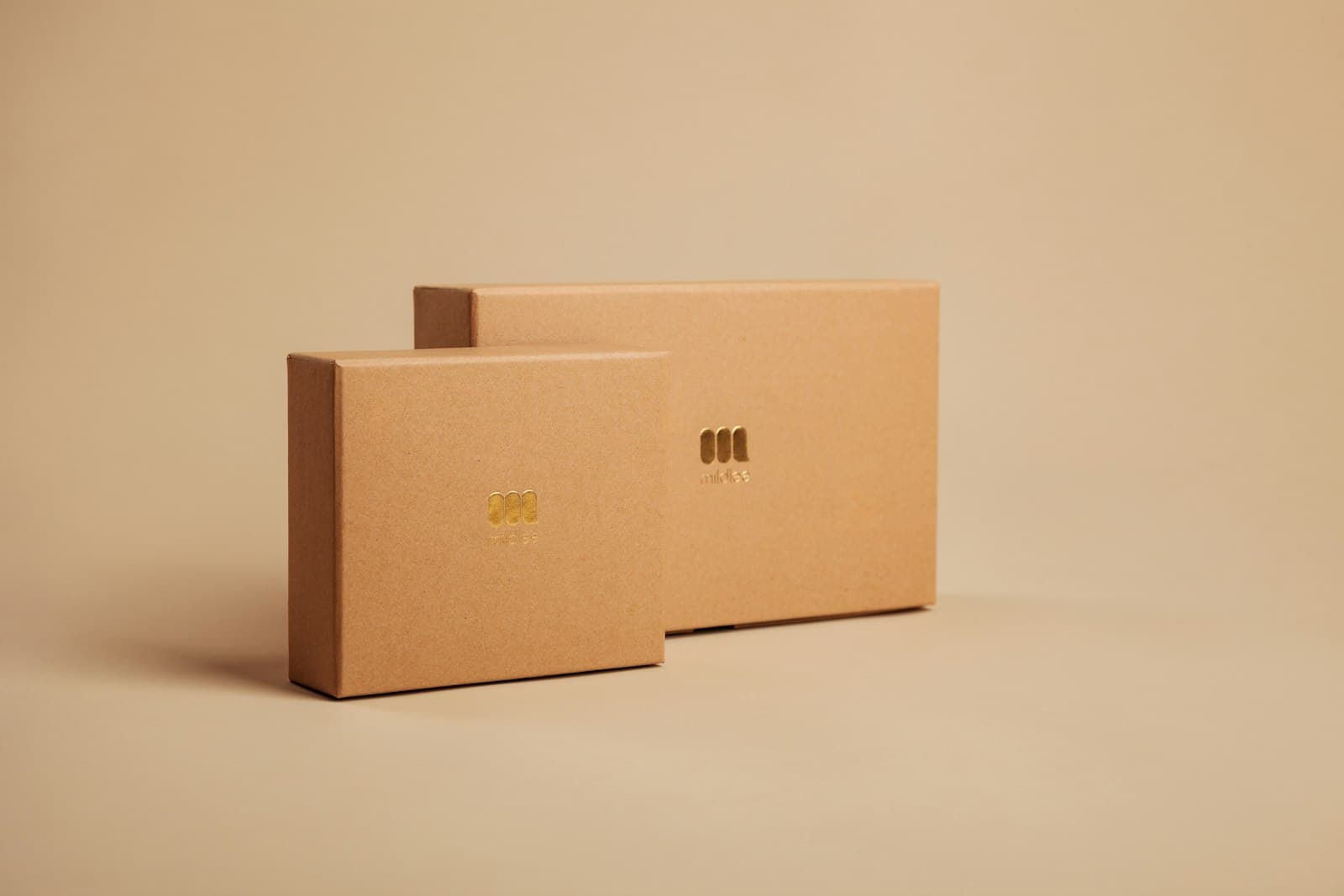 Branded kraft gift boxes with gold foil logo