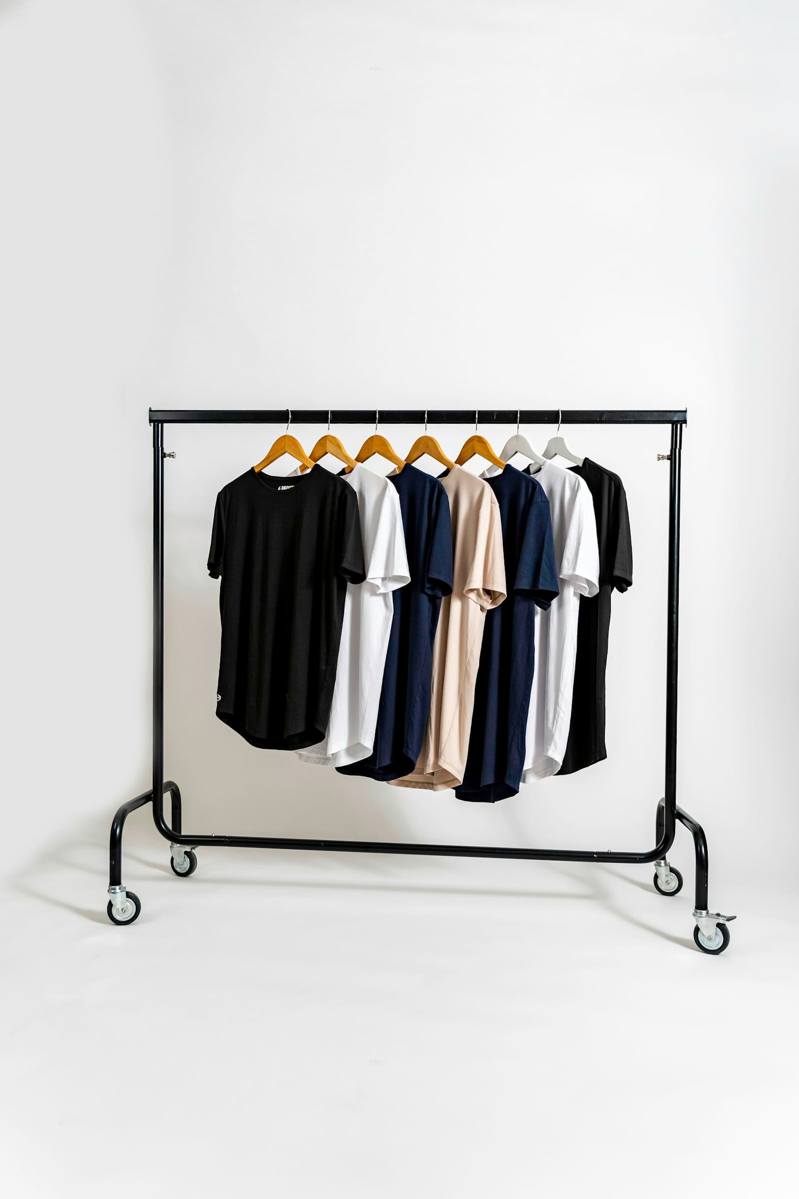 Conference and event runs. Tees, caps, and bags at volume.